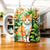 Tasse Chat Paisible : mug céramique blanc avec chat tigré orange et blanc parmi feuillage vert et lys orange