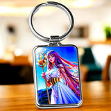 Porte-clé Athéna : femme fantasy aux cheveux violets et roses avec bâton doré