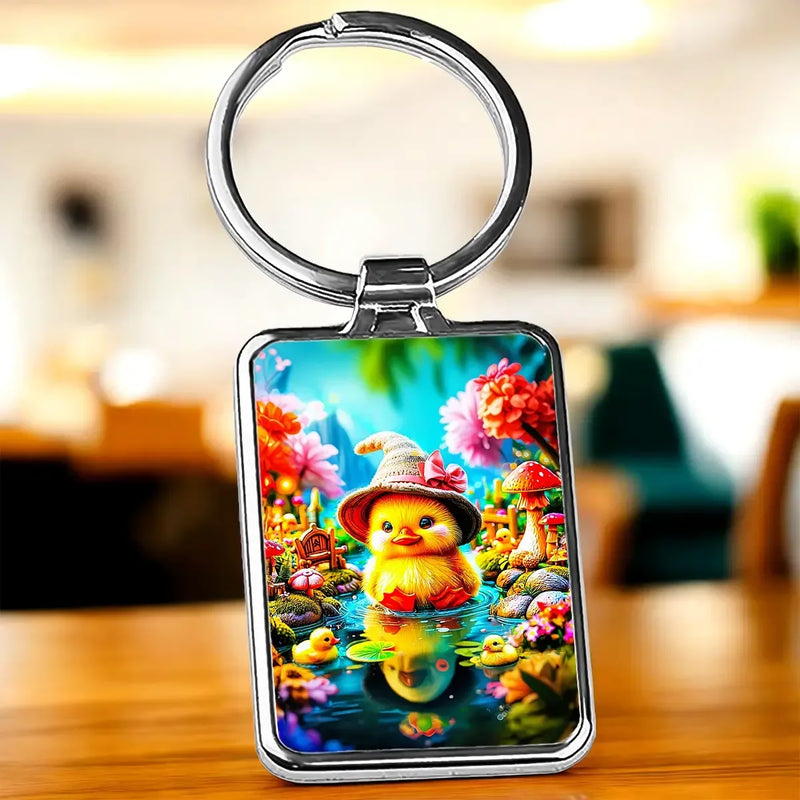 Porte-clé Canneton : canard jaune au chapeau de paille en jardin coloré