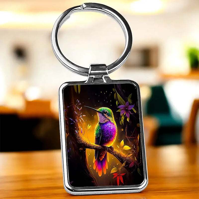 Porte-clé Colibris Violet : colibri sur branche fleurie en cadre argenté