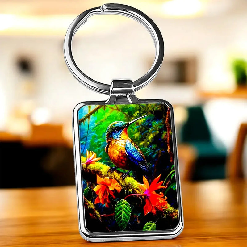Porte-clé Colibris : colibri coloré sur branches mousseuses et fleurs tropicales