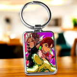 Porte-clé Dandadan rectangulaire argenté avec illustration anime vibrante