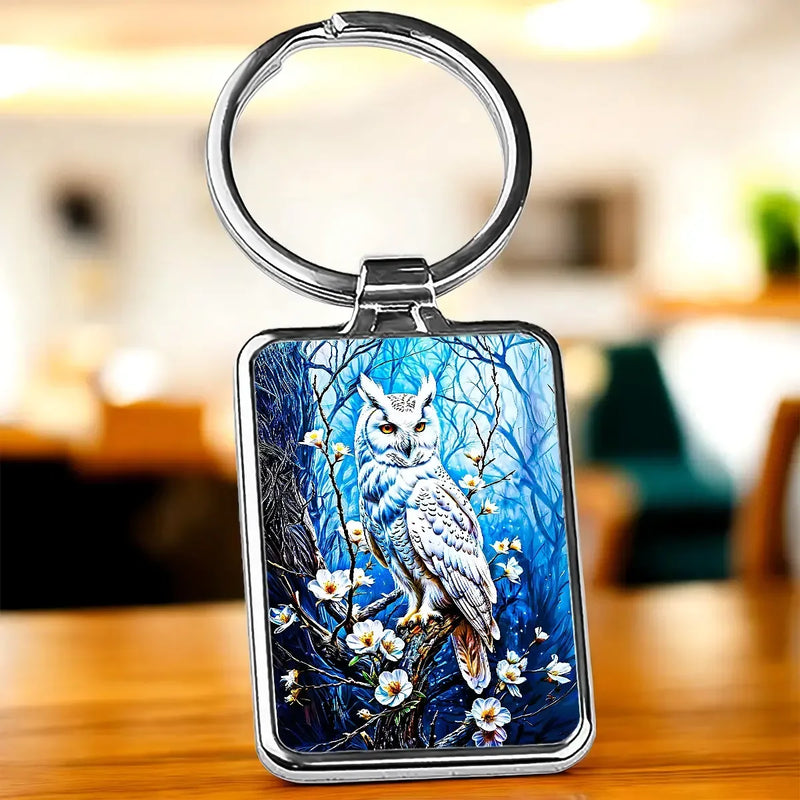 Porte-clé Hiboux : chouette blanche sur branches fleuries, fond bleu