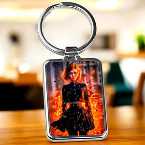 Porte-clé Nobara rectangulaire avec cadre argenté et portrait illustré sur fond orange