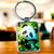 Porte-clé panda cartoon aux bulles bleues et feuillage vert