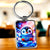 Porte-clé Petit Pingouin : pingouin bleu mignon sur fond cosmique coloré