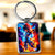 Porte-clé argenté Goku Super Saiyan Blue avec effets énergétiques