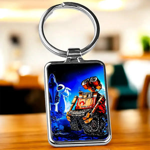 Porte-clé WALL-E : robot animé et Eve sur fond étoilé bleu